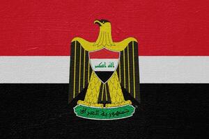 drapeau et manteau de bras de république de Irak sur une texturé Contexte. concept collage. photo