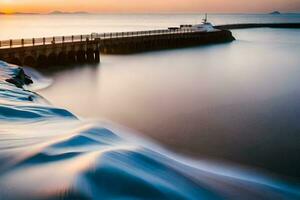 une longue exposition photographier de une jetée à le coucher du soleil. généré par ai photo