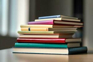 une livre pile proche en haut sur une étude bureau. de face vue pile livre. pour Festival de monde livre jour, nationale livre journée ou nationale éducation journée. empiler de coloré livres sur étude table par ai généré photo