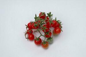 Cerise tomates sur une blanc Contexte photo