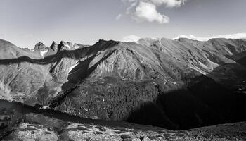 une Montagne vue avec une la personne permanent sur Haut de une pente ai génératif photo