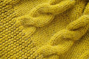 fond tricoté. texture tricotée. modèle de tricot de laine. photo