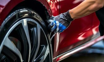 homme méticuleusement nettoyage une voiture avec une microfibre chiffon. ai généré photo