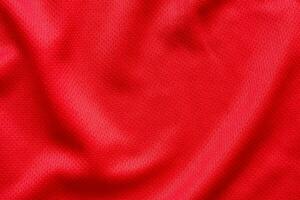 fond de texture de maillot de football de tissu de vêtements de sport rouge photo