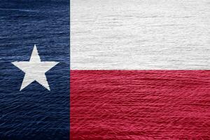 Texas nous Etat drapeau sur texturé Contexte. conceptuel collage. photo