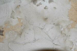 texture grunge fissurée et abstraite. toile de fond de surface de matériau vieilli. motif effet patiné. fond vieux et sale. photo