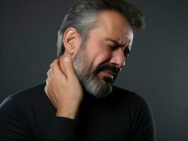 homme avec douleur sur neutre Contexte ai génératif photo