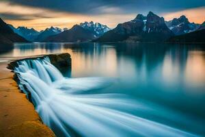 le l'eau chutes dans le Lac à le coucher du soleil. généré par ai photo