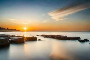 une magnifique le coucher du soleil plus de le océan avec rochers dans le l'eau. généré par ai photo