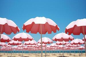 rose parapluie dans le plage Contexte photo