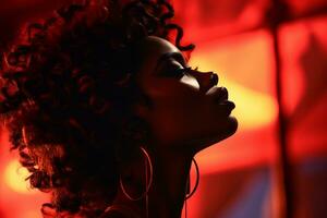 un africain américain femme avec gros des boucles d'oreilles dans de face de une rouge lumière génératif ai photo
