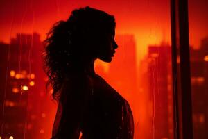 silhouette de une femme permanent dans de face de une fenêtre avec une ville dans le Contexte génératif ai photo