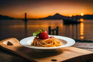 une assiette de spaghetti avec une fraise sur Haut. généré par ai photo