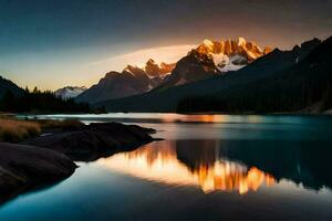 le montagnes sont réfléchi dans le l'eau à le coucher du soleil. généré par ai photo