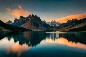 le montagnes sont réfléchi dans le l'eau à le coucher du soleil. généré par ai photo