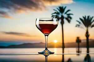 une verre de du vin sur une table dans de face de le le coucher du soleil. généré par ai photo