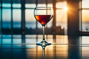 une verre de rouge du vin sur une table dans de face de le Soleil. généré par ai photo