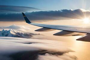 un avion aile en volant plus de le montagnes et des nuages. généré par ai photo