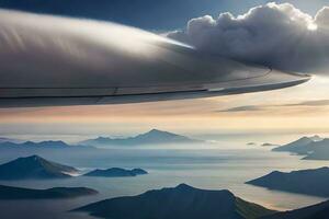 une vue de le aile de un avion en volant plus de montagnes. généré par ai photo