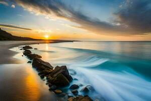 une le coucher du soleil plus de le océan avec rochers et l'eau. généré par ai photo