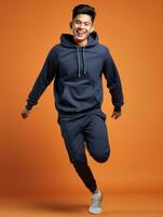 Jeune asiatique homme habillé dans tenue de sport clairement actif et plein de énergie ai génératif photo