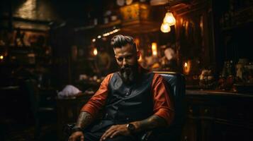 Beau barbu homme séance dans coiffeur magasin et fumeur cigare. photo