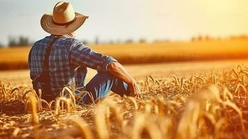 Sénior agriculteur séance dans une blé champ après récolte et regards dans le distance. génératif ai photo