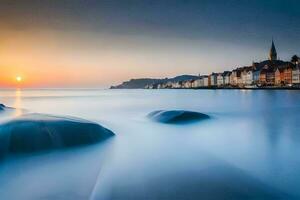 une longue exposition photographier de rochers dans le l'eau à le coucher du soleil. généré par ai photo