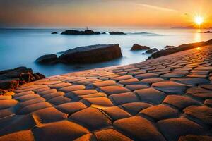 le Soleil ensembles plus de une plage avec rochers et sable. généré par ai photo