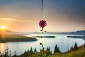 une fleur est pendaison de une pôle dans de face de une lac. généré par ai photo