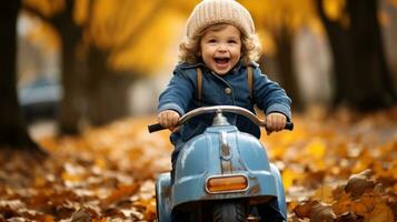 une Jeune enfant équitation une peu voiture par le feuilles dans le tomber photo