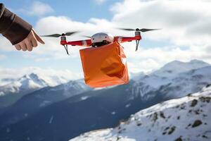 ai génératif. une drone livre un commande ou premier aide dans un Orange paquet en volant par le neigeux Montagne pics dans ensoleillé temps photo
