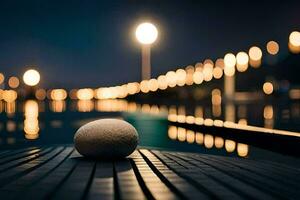 une Balle est assis sur une Dock à nuit avec lumières dans le Contexte. généré par ai photo