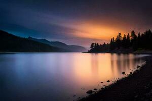 une Lac dans le montagnes à le coucher du soleil. généré par ai photo