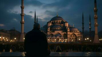 prier à le bleu mosquée à crépuscule photo