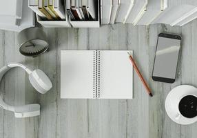 une salle de travail avec des livres posés sur une table blanche avec des écouteurs photo