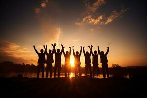 joyeux unité silhouettes de une équipe joindre mains dans le air ai généré photo