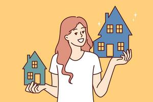 femme agent immobilier détient deux Maisons offre à choisir propriété elle aime et organiser hypothèque ou location photo