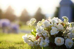 blanc fleurs dans de face de une pierre tombale à une cimetière avec coucher de soleil.funérailles concept ai généré photo