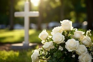 blanc fleurs dans de face de une pierre tombale à une cimetière avec coucher de soleil.funérailles conceptuel généré photo