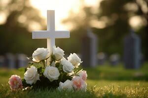 blanc fleurs dans de face de une pierre tombale à une cimetière avec coucher de soleil.funérailles concept ai généré photo