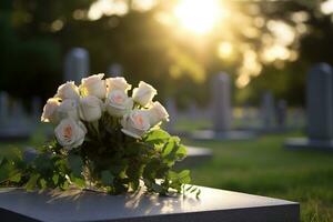 blanc fleurs dans de face de une pierre tombale à une cimetière avec coucher de soleil.funérailles concept ai généré photo