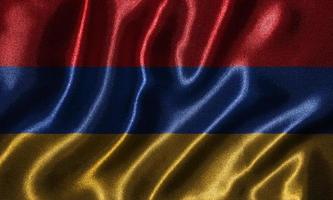 papier peint par drapeau arménien et drapeau ondulant par tissu. photo