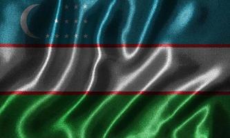 papier peint par drapeau ouzbekistan et drapeau ondulant par tissu. photo