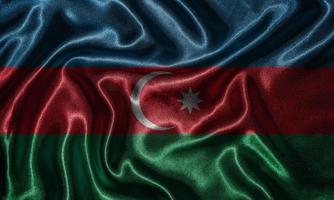 papier peint par drapeau azerbaïdjanais et drapeau ondulant par tissu. photo