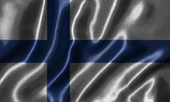 papier peint par drapeau finlandais et drapeau ondulant par tissu. photo