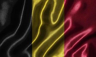 papier peint par drapeau belge et drapeau ondulant par tissu. photo