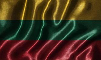 papier peint par drapeau lituanien et drapeau ondulant par tissu. photo