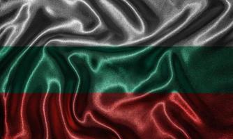 papier peint par drapeau bulgare et drapeau ondulant par tissu. photo