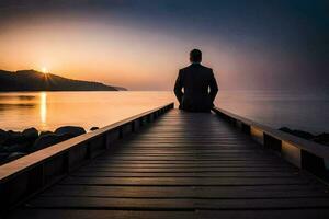 une homme séance sur une Dock à le coucher du soleil. généré par ai photo